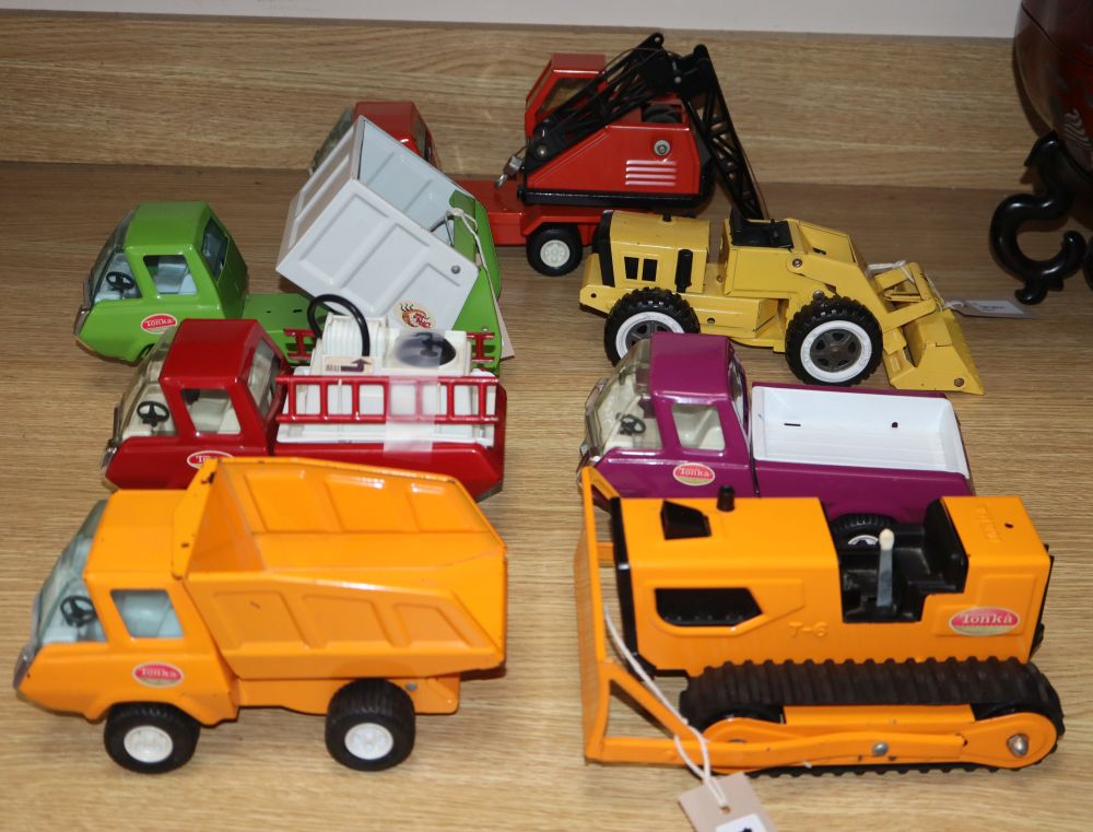 Seven 1970s Tonka diecast vehicles and a Corgi 853 Magic Roundabout Playground set